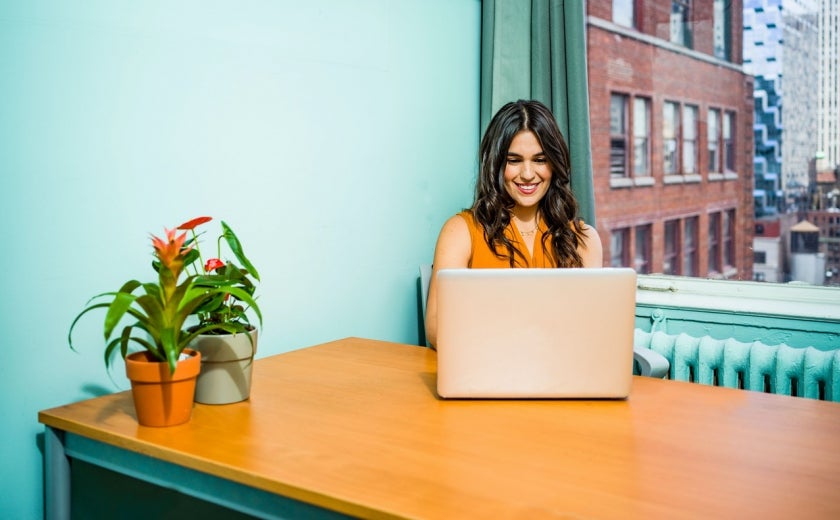 Woman Sitting at Laptop