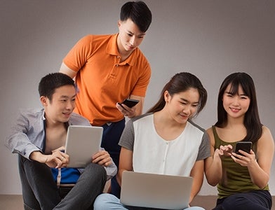 Group of students using devices (AI Generated)