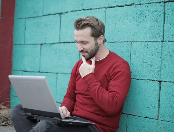 man looking at laptop