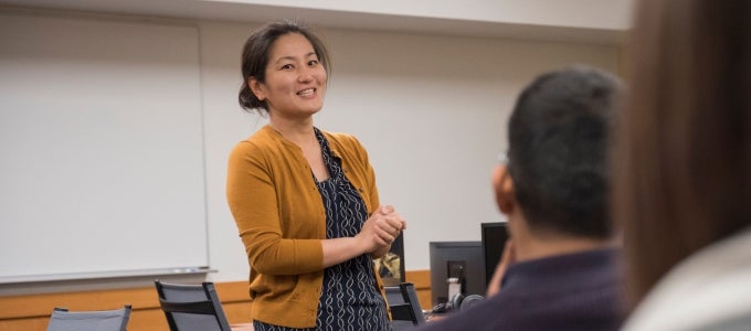 faculty presenting in front of people