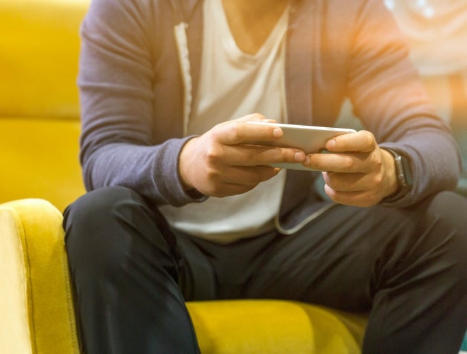 student holding phone