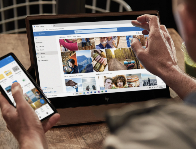person using microsoft onedrive on multiple devices
