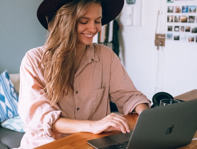 woman smiling at laptop